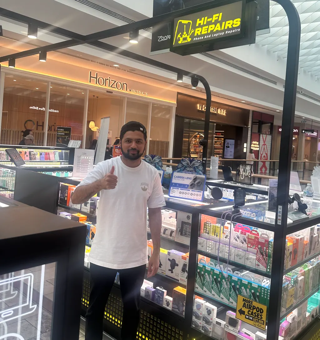Aqeel, Manager at Hi-Fi Repairs The Glen, standing in the store at The Glen Shopping Centre
